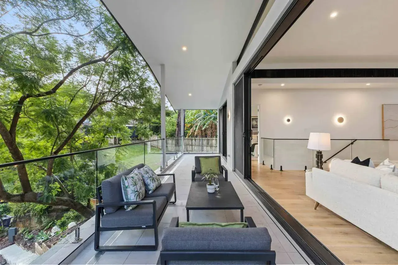 The approved front balcony, open to the tree canopy