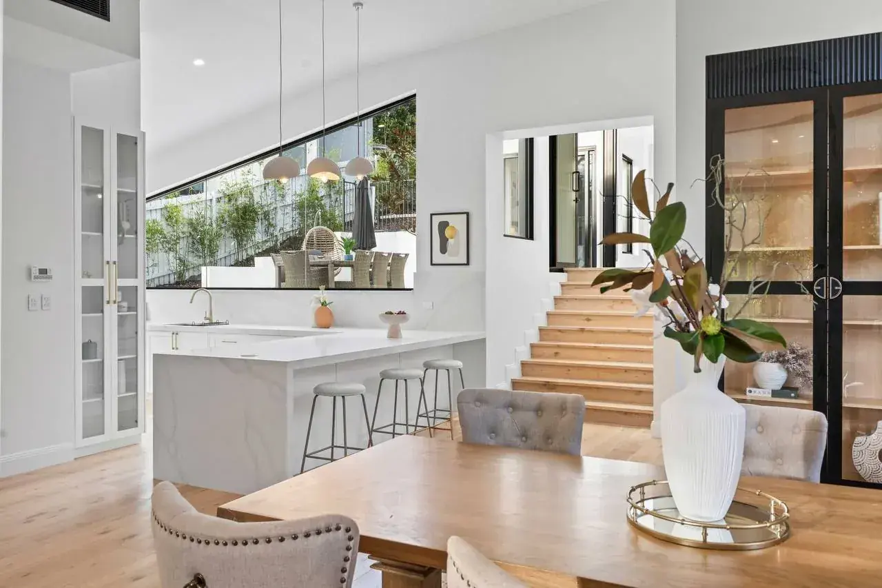 Kitchen and dining with a long raked window following the roof line